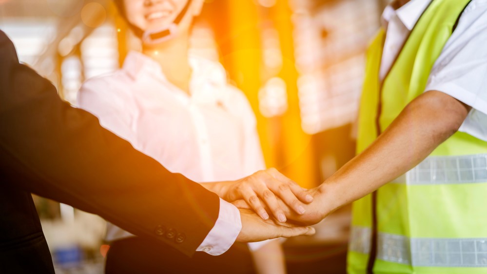 Close,Up,Hands,Of,Young,Business,People,With,Industrial,Engineers